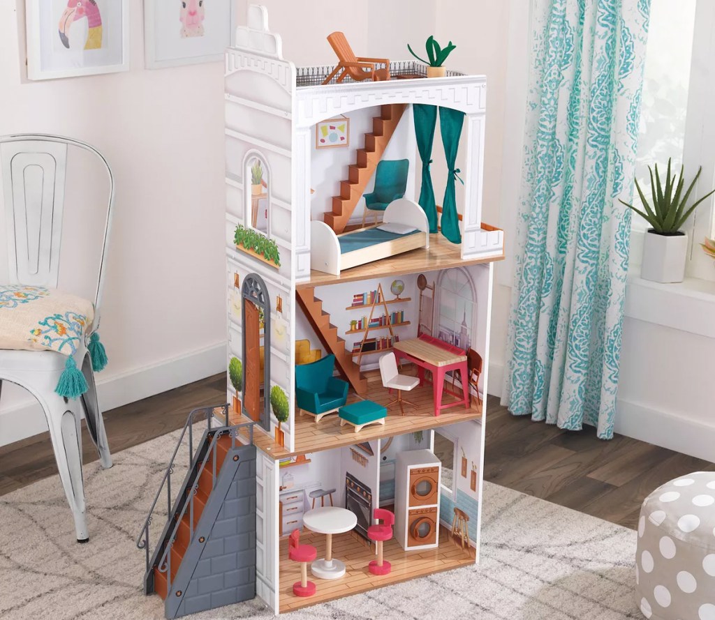 tall kidkraft dollhouse in playroom