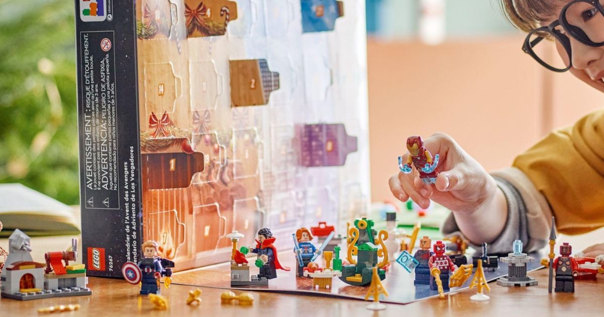 a child playing with a LEGO Harry Potter advent calendar