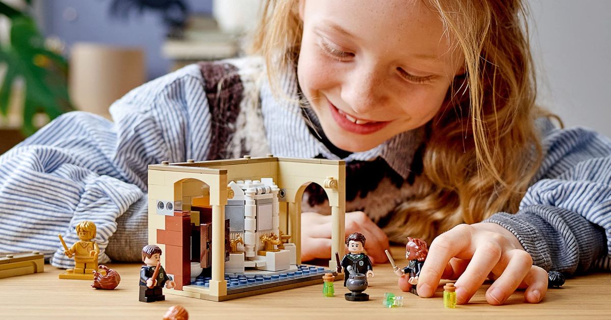 Girl playing with LEGO Harry Potter Polyjuice Potion Set