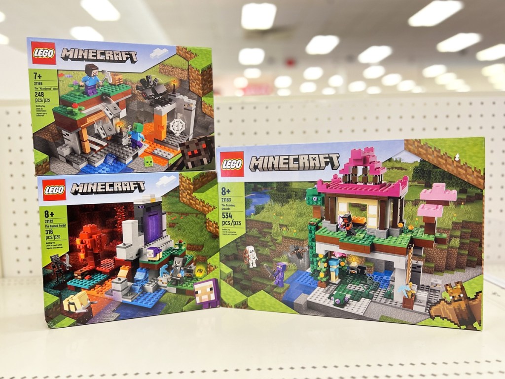 three lego minecraft sets on display in store