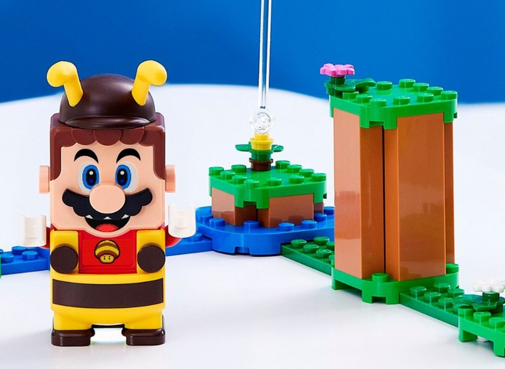 LEGO Mario toy in a bee costume with LEGO's behind him