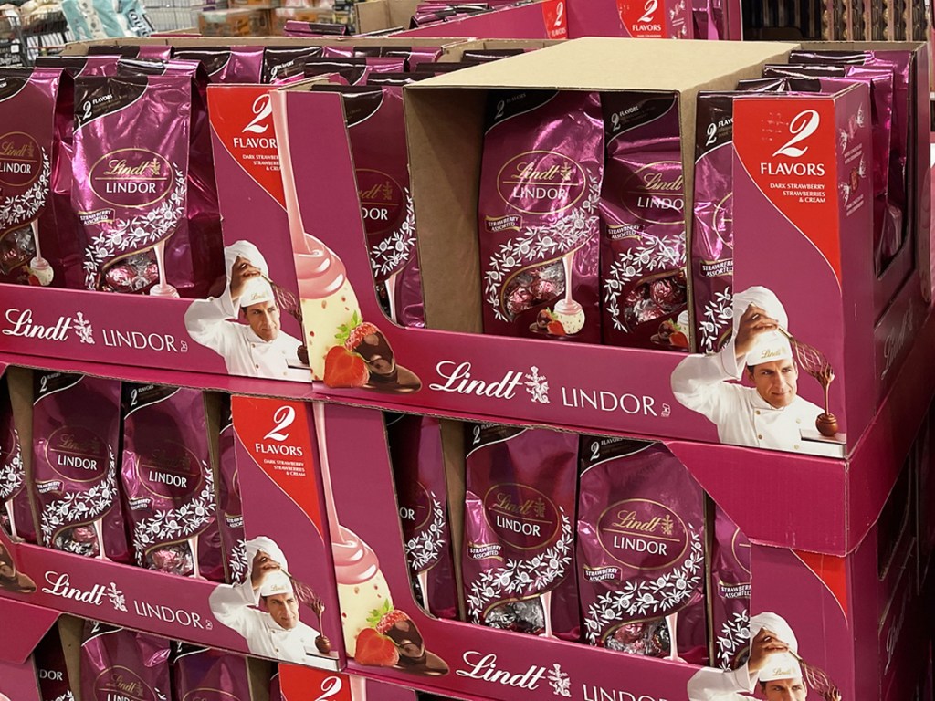 display of pink bags of Lindt Strawberry Truffles in costco