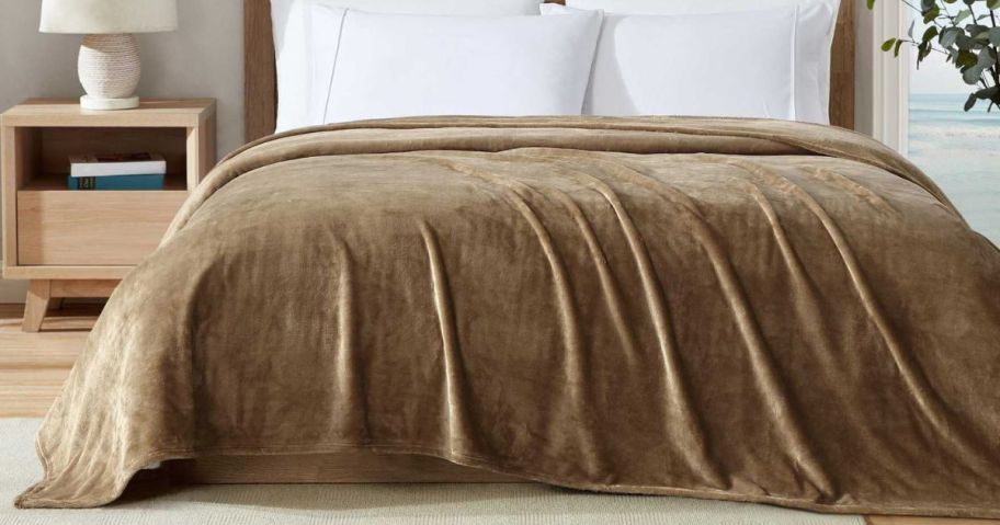 A brown blanket on a bed