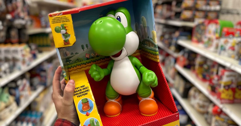 hand holding green toy dinosaur figure