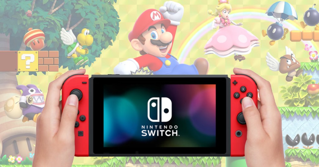 left and right hand holding up a Nintendo Switch with faded images of Mario and other video game characters in the background