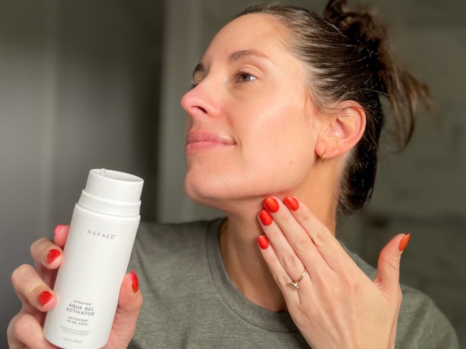 woman putting a NuFace gel on her face