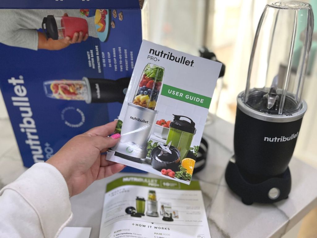 Contents of the Nutribullet Pro+ box including a recipe booklet and the blender with base, blade and cups