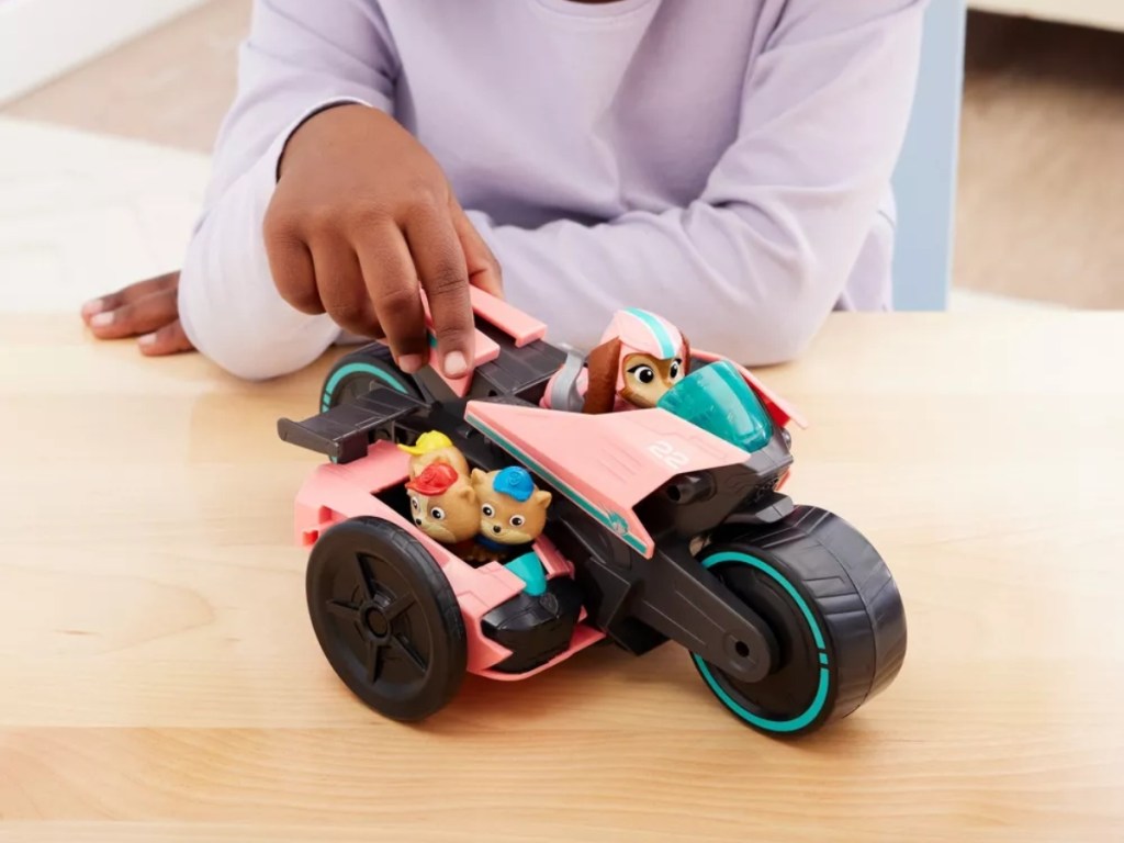 playing with a PAW Patrol vehicle playset