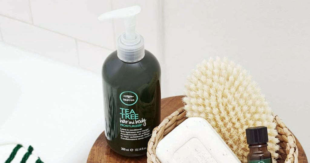 Paul Mitchell Tea Tree Hair and Body Moisturizer on stool near shower products
