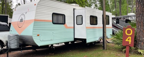 pink, teal and white rv camper