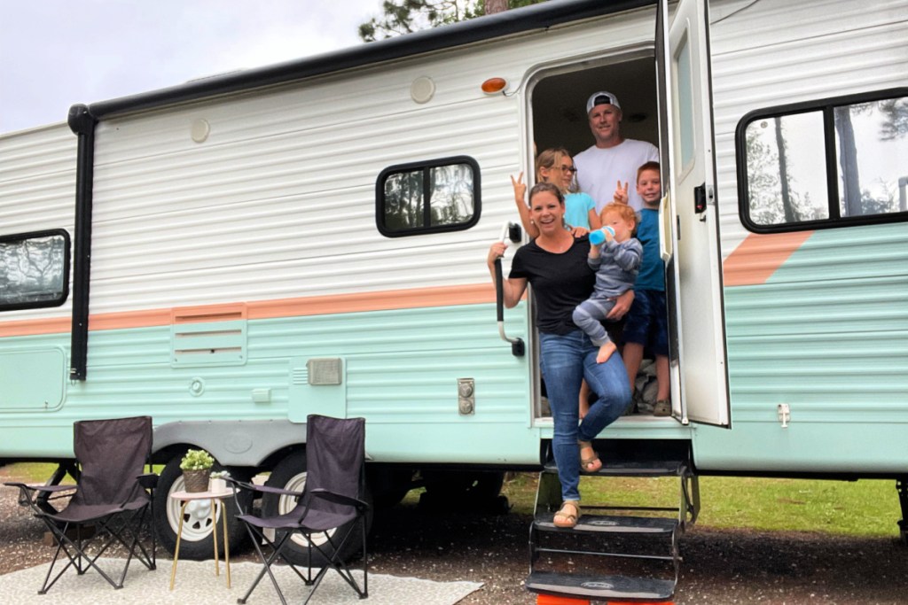 family exiting an RV