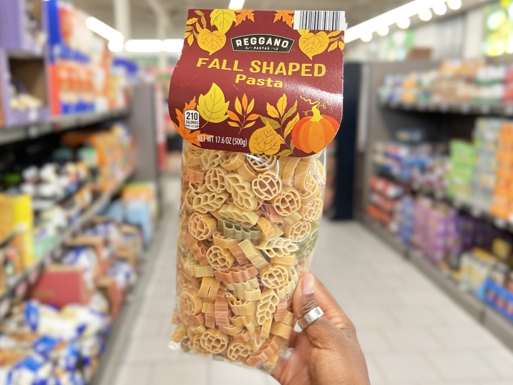 hand holding up bag of Reggano Fall-Shaped Pasta