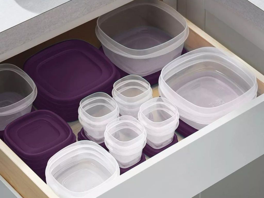 plastic containers with purple lids in drawer