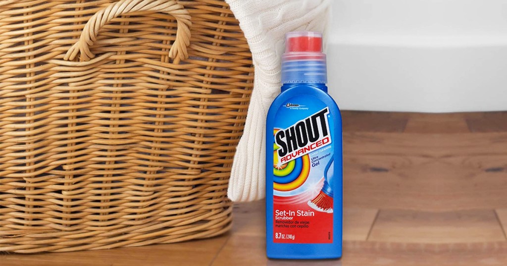 bottle of shout stain remover next to basket
