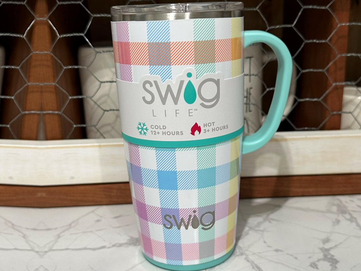 https://hip2save.com/wp-content/uploads/2022/12/Swig-Tote-Mug-in-plaid.jpg