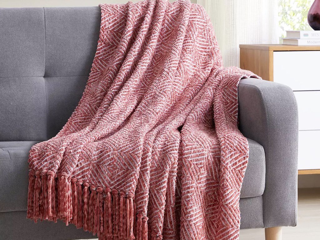 red throw blanket on a couch