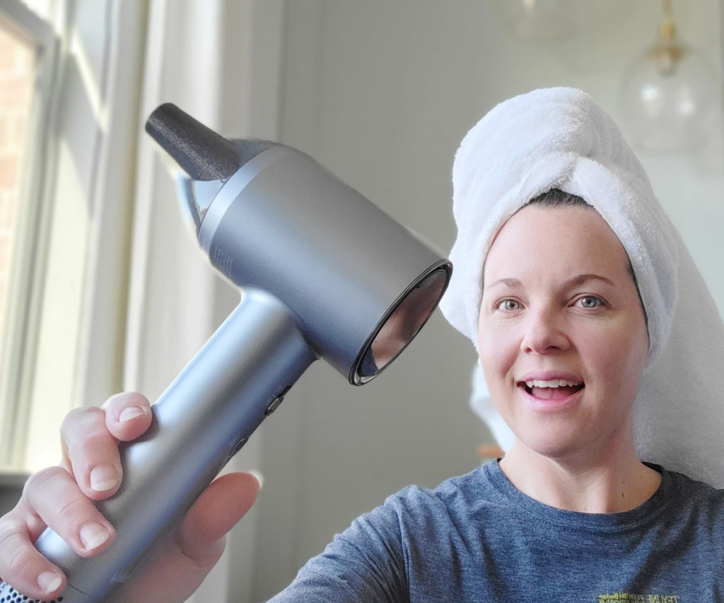 woman with hair dryer