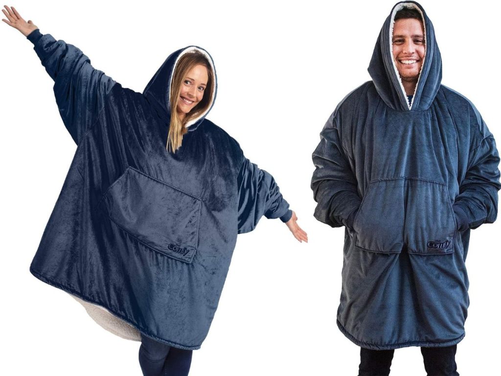 A woman and a man each wearing The Comfy wearable hooded blanket