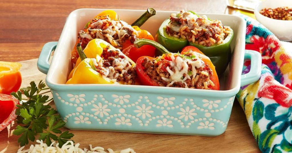 blue and white The Pioneer Woman baking dish filled with stuffed peppers