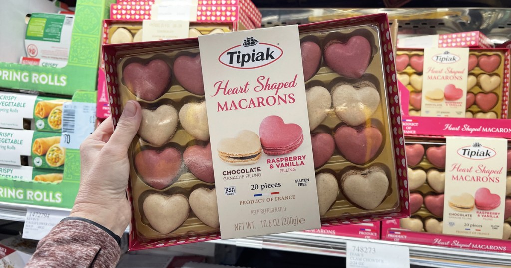 hand holding package of Heart Shaped Macarons