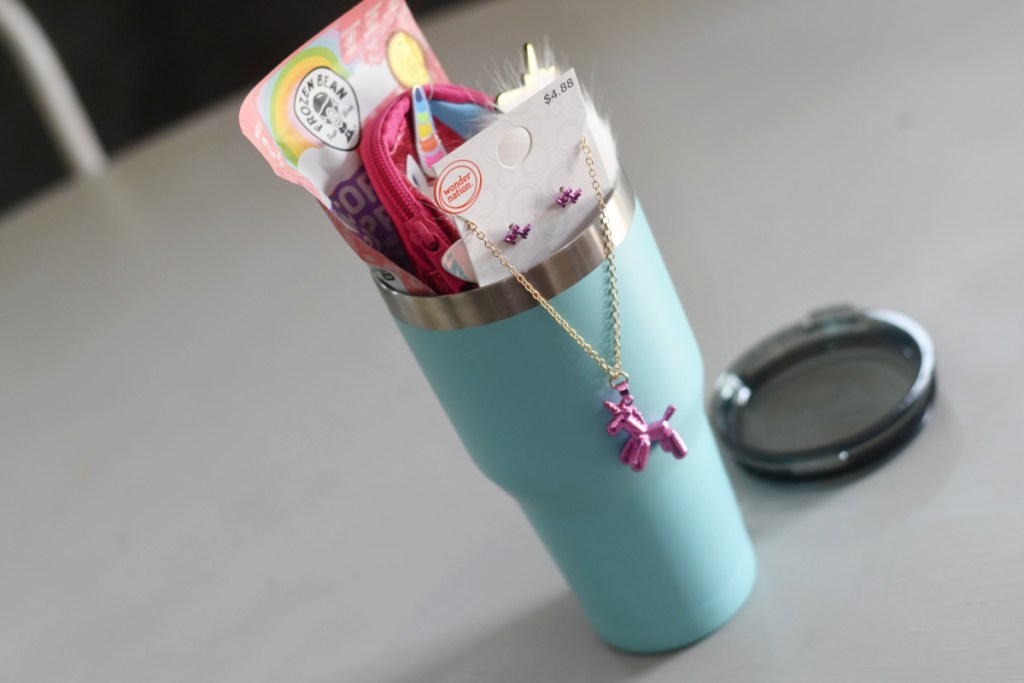 a tumbler filled with unicorn gifts