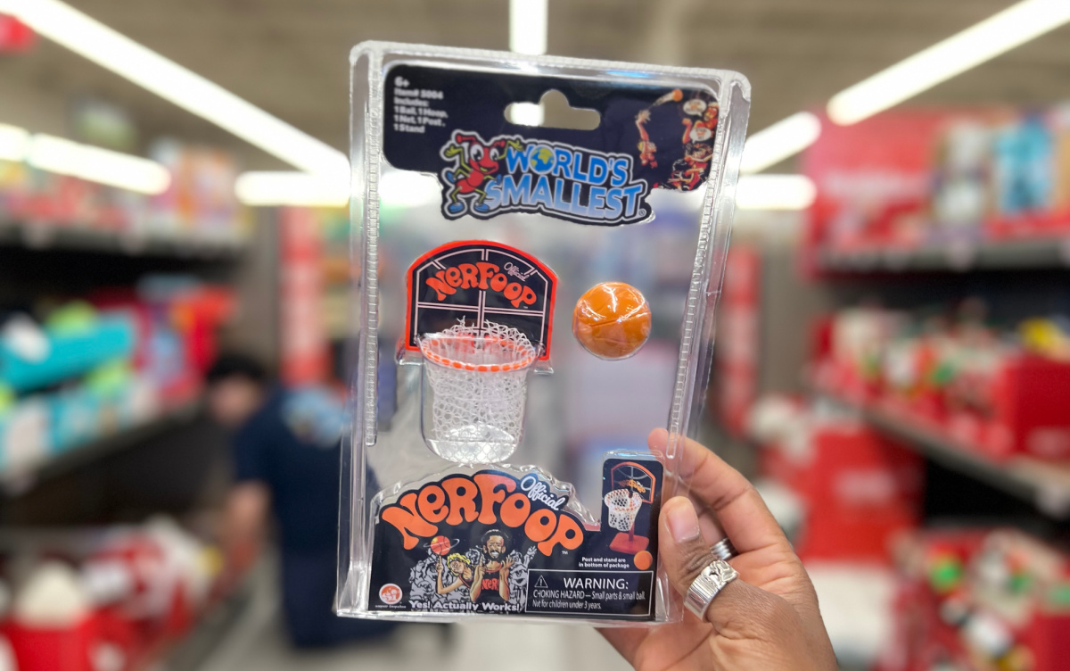 Hand holding up one of the World's Smallest Toys, a Nerf Hoops Set at Aldi