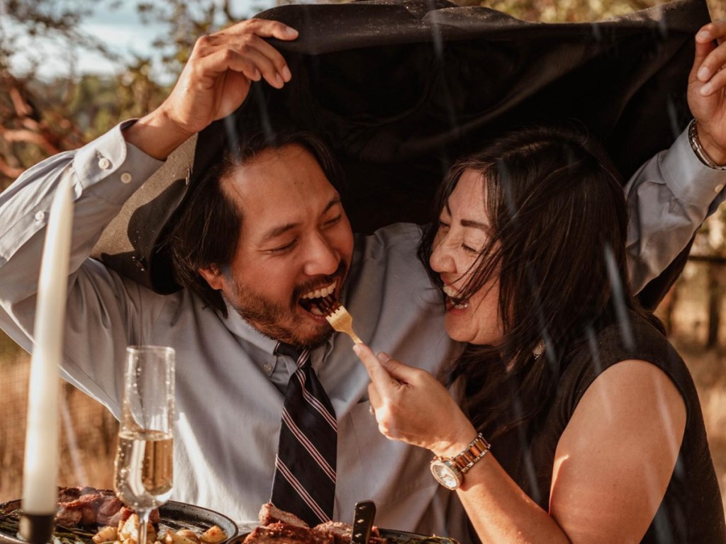 couple eating in rain