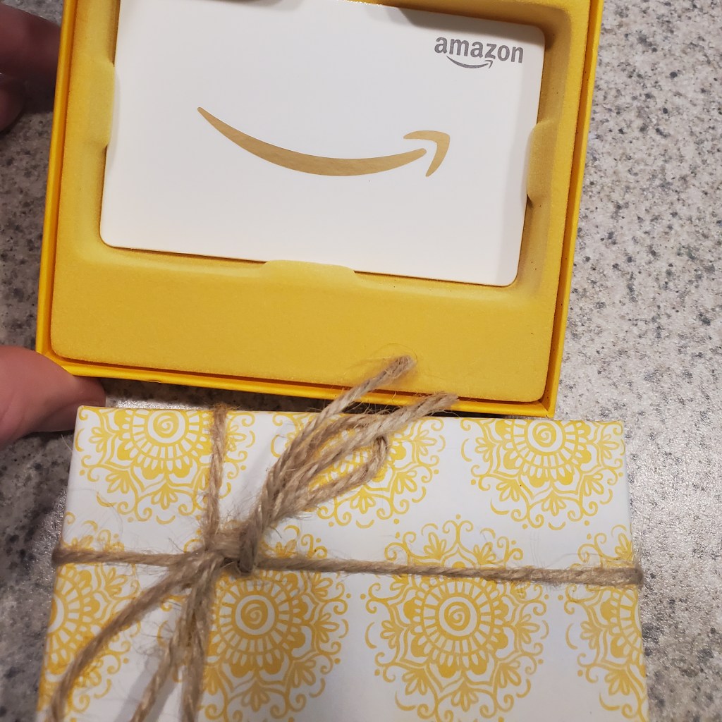 Amazon gift card in a yellow box