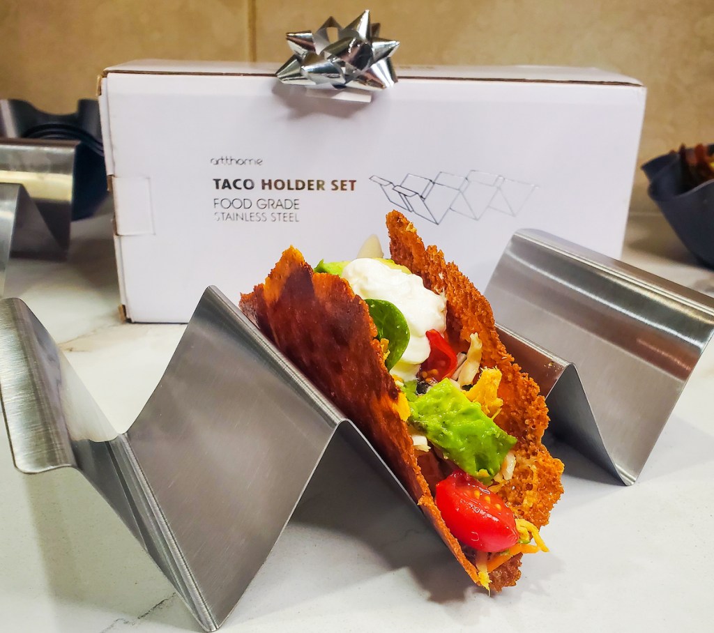 stainless steel taco holder with cheese taco inside