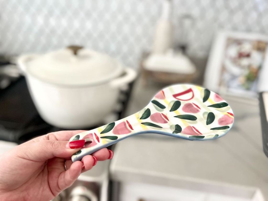 hand holding floral spoon rest