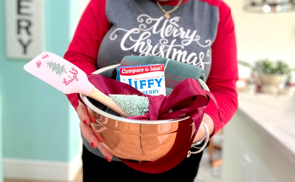 woman holding copper bowl gift basket with baked goods inside last minute christmas gifts