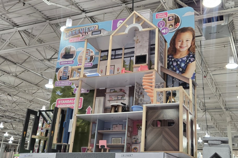 extra large dollhouse in store on top shelf