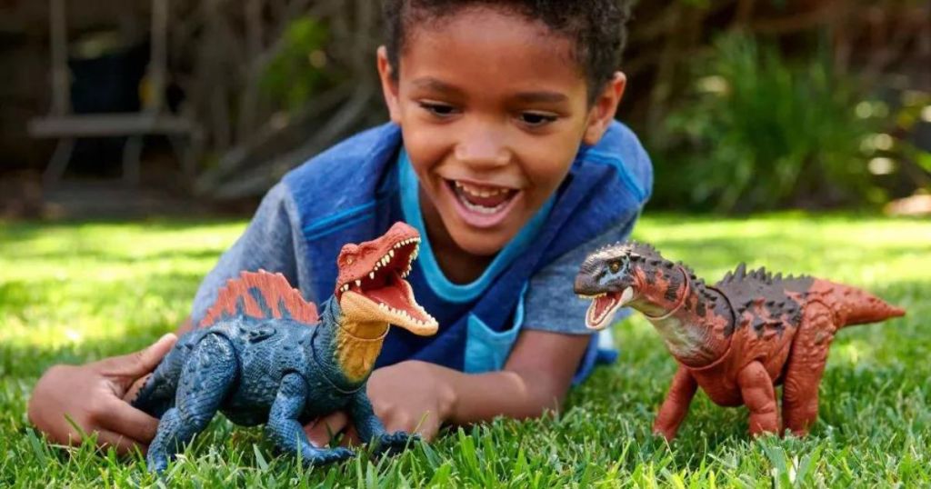 kid playing with dinosaur
