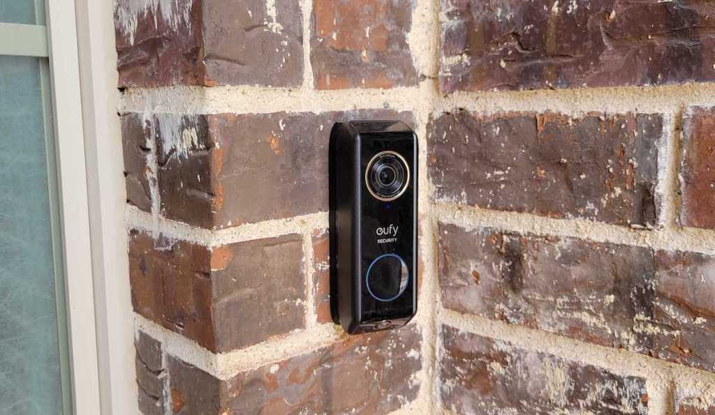 close up of eufy doorbell on brick 