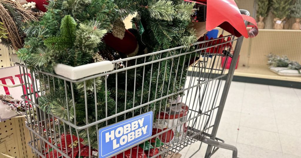 hobby lobby shopping cart filled with christmas decor