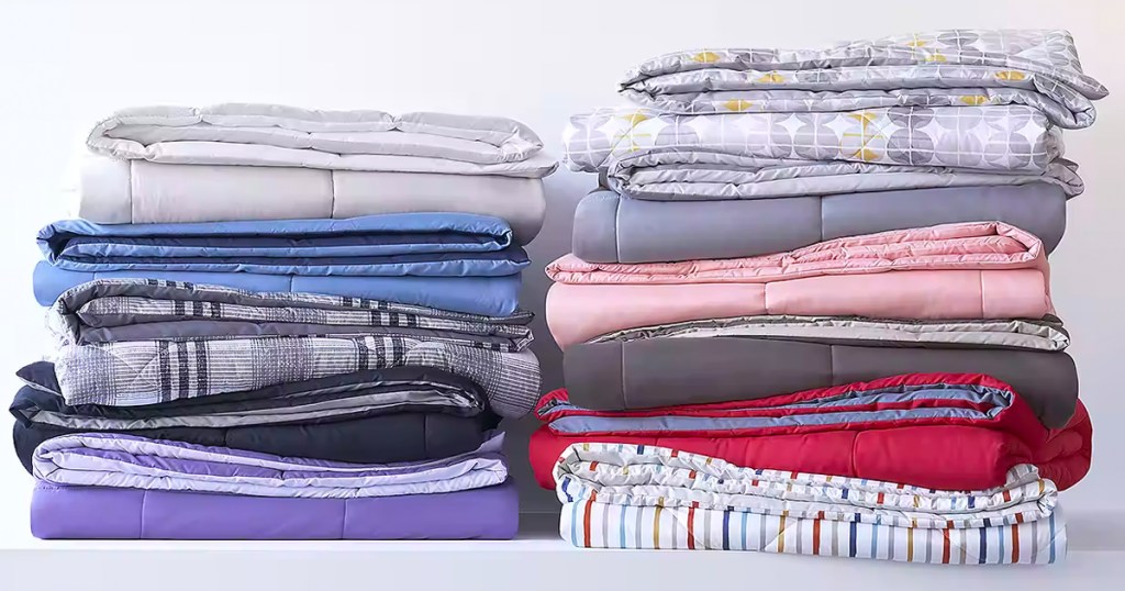 comforters in multiple colors folded and stacked