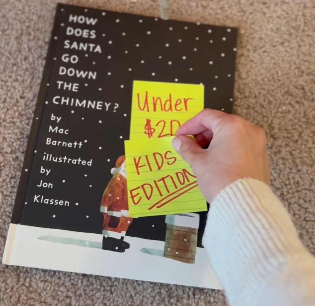 hand holding yellow post it note on how does santa go down the chimney book