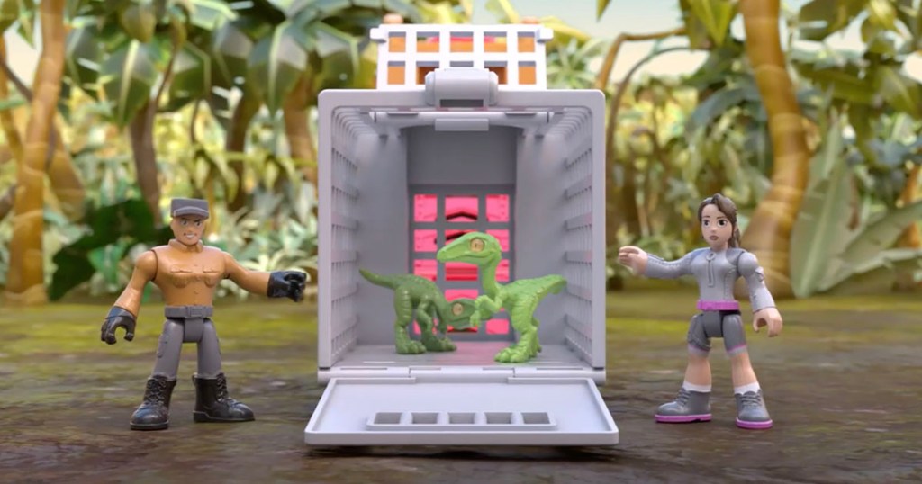 two dinosaurs in hauler cage toy