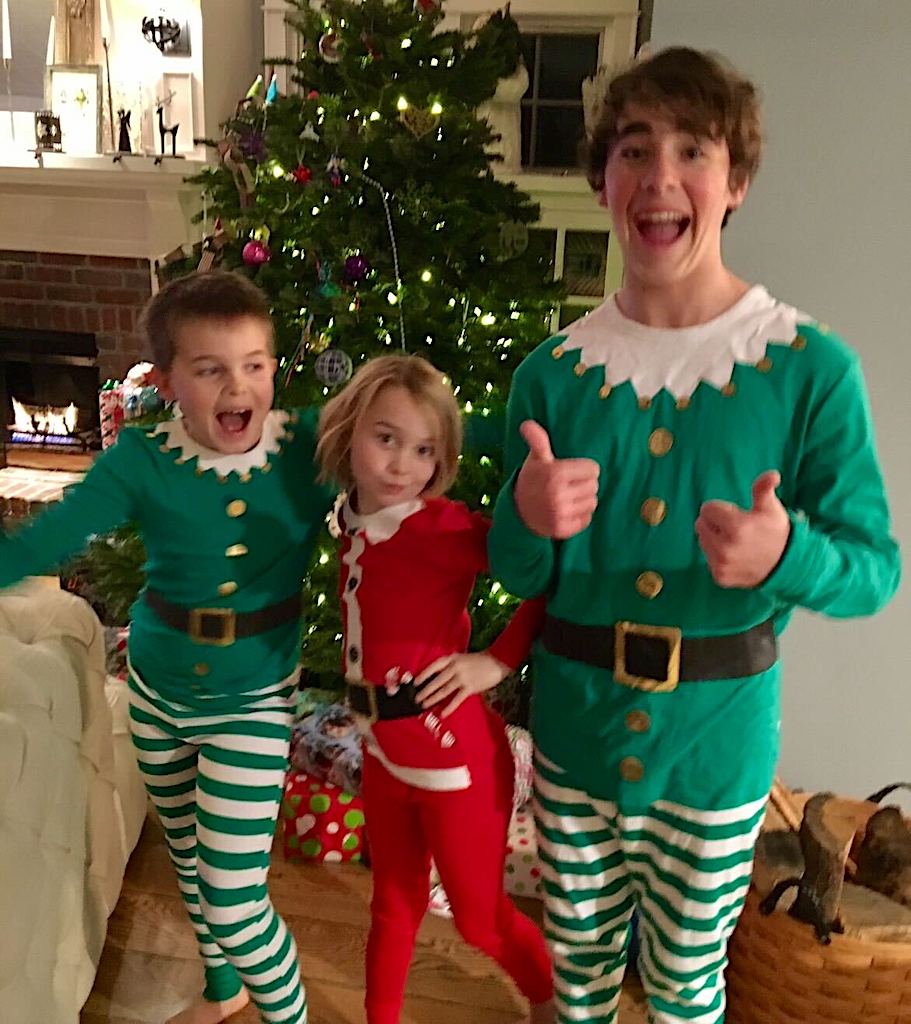 collin's 3 kids at Christmas by the tree