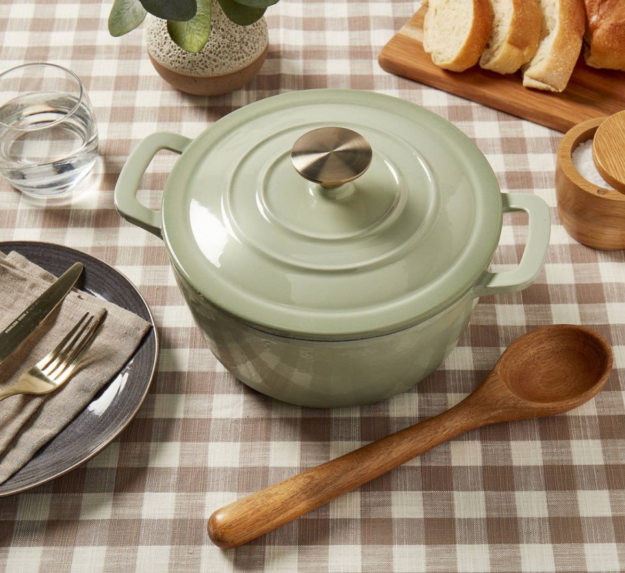 green cast iron on checkered tablecloth