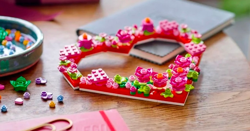 pink and red flower ornament wreath on table
