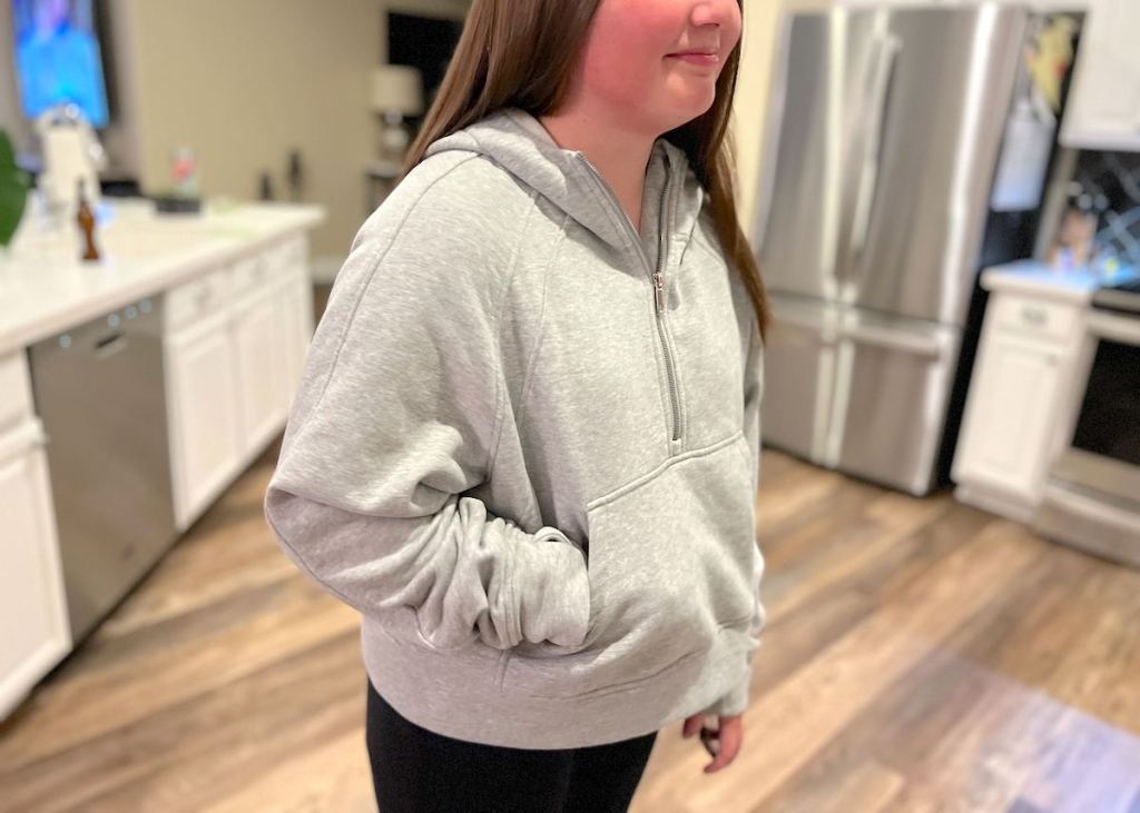 close up of girl wearing gray scuba hoodie