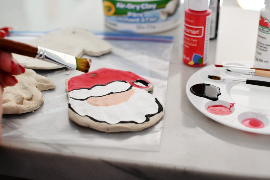 painting a santa ornament with craft paint