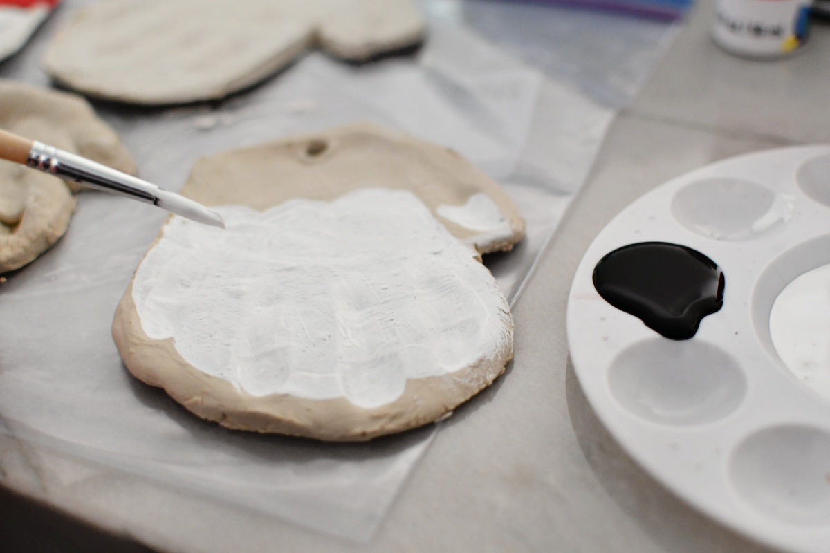 the-easiest-diy-santa-ornaments-using-handprints-air-dry-clay
