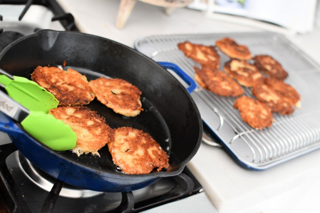 pan with fried potato latkes