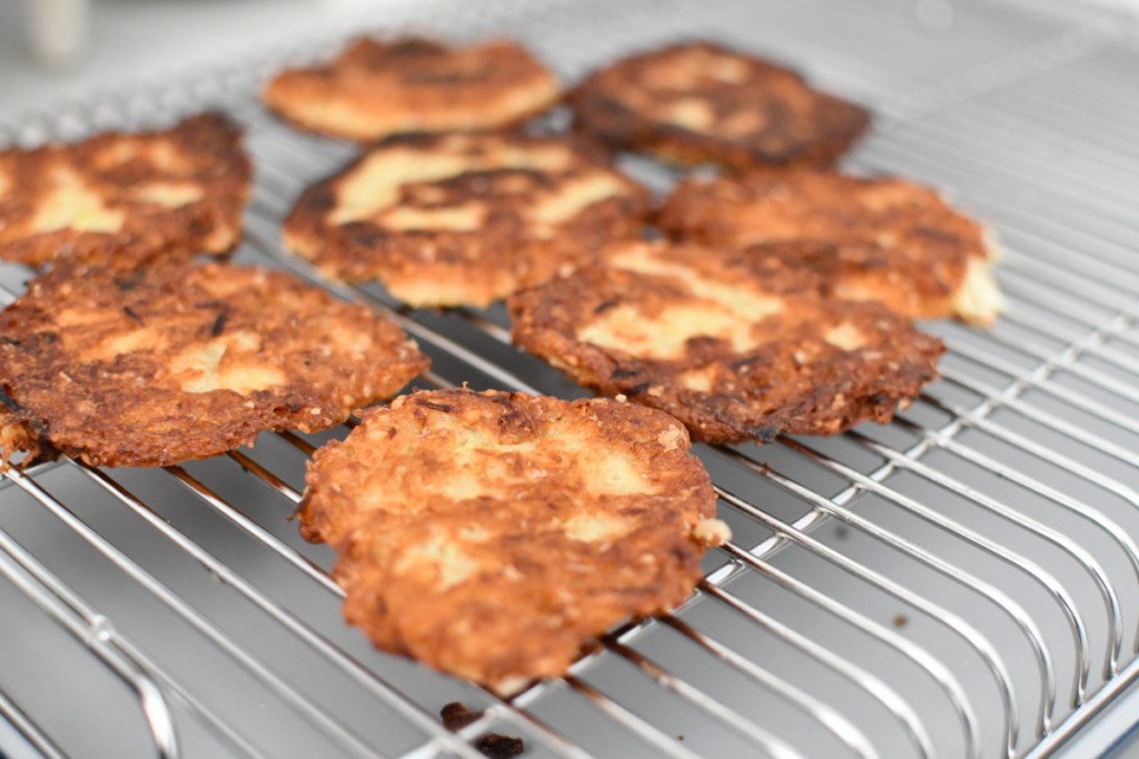 potato latkes drying on a pan