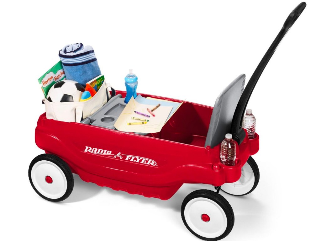 deluxe radio flyer wagon with toys and kids items inside