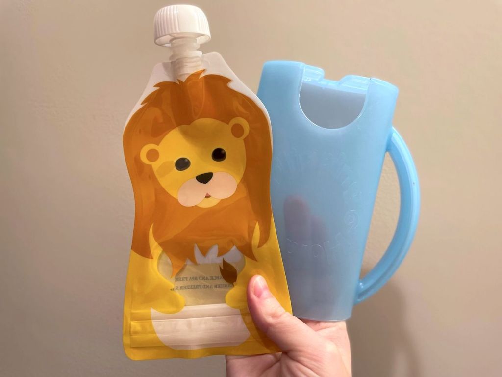 hand holding tiger baby food pouch with blue flipping holder 