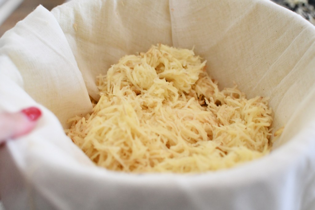 shredded potato in a cheesecloth