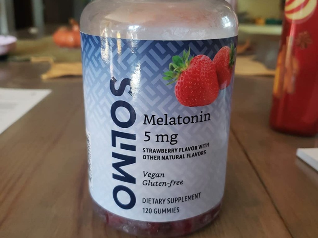 bottle of solimo amazon melatonin on a table